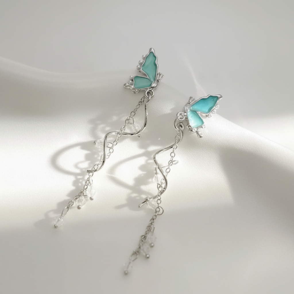 Teal Butterfly Drop Earrings studio shot white background