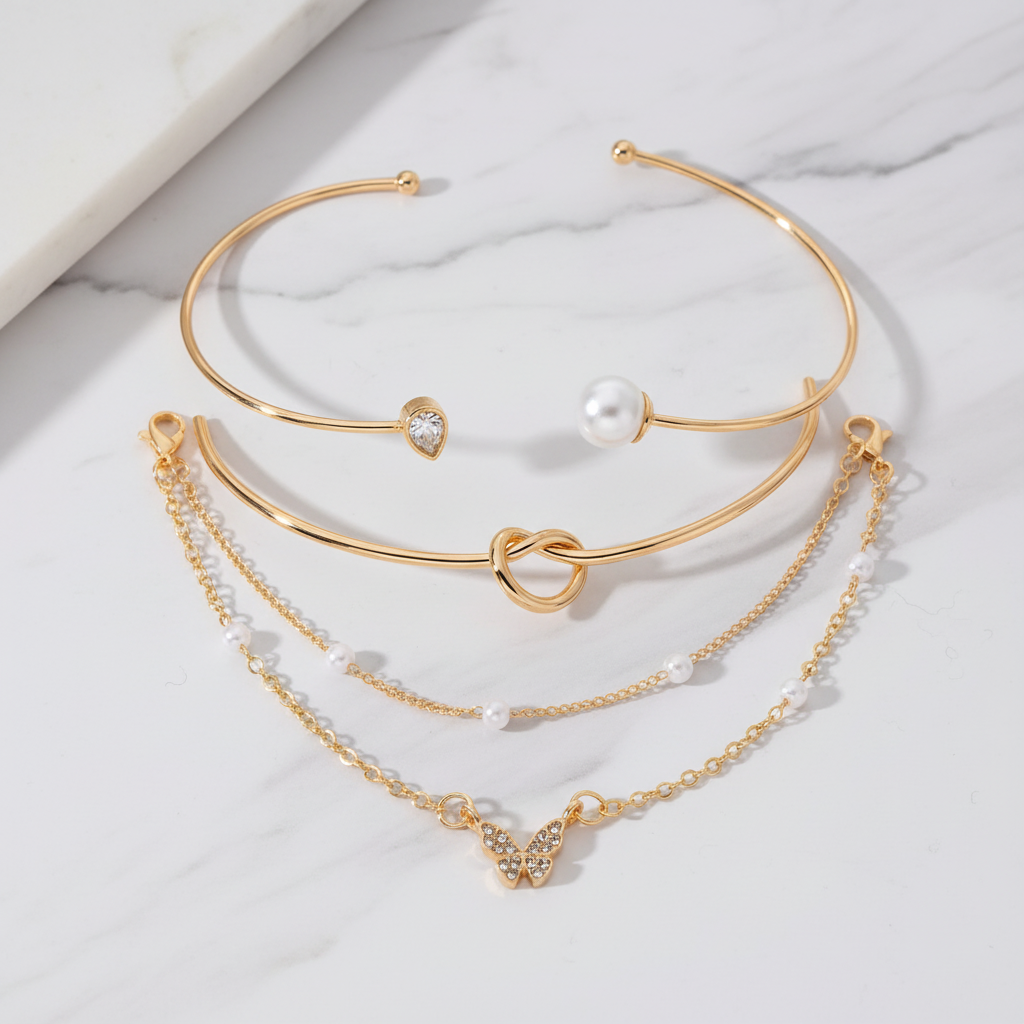 4 Piece Gold Bracelet Set flat lay marble