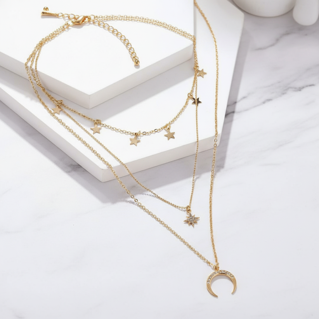 Layered Gold Star Moon Necklace flat lay marble